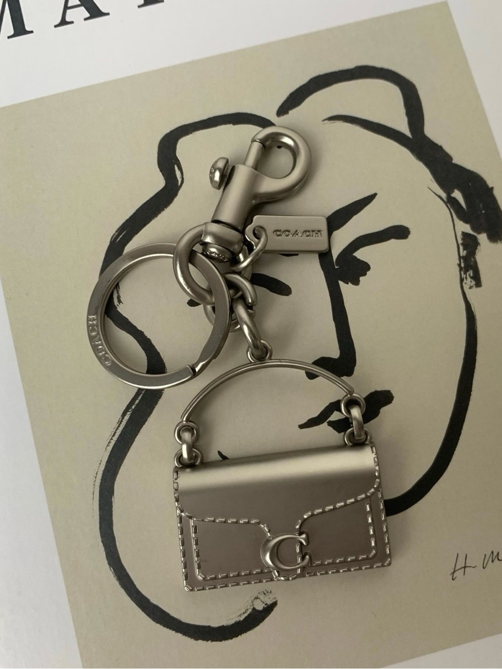 Coach Tabby Bag Charm Featuring the Iconic “C” Logo Hardware